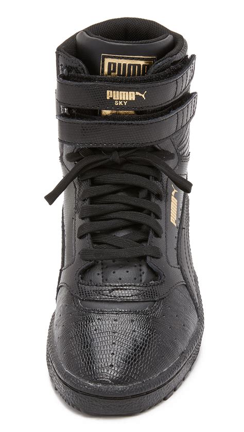 puma black high top sneakers.